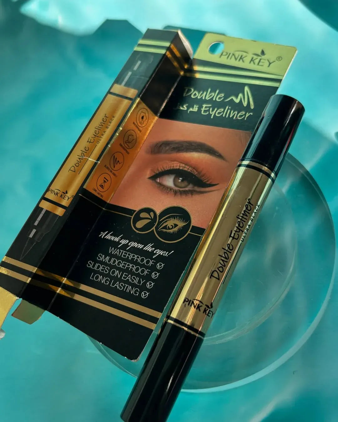 Pink Key Double Eyeliner Pen with 2-in-1 dual tip, waterproof, smudge-resistant, and long-lasting ultra-black formula for precise eye makeup.